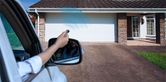 Birkdale Classic Grey Roller Garage Door lifestyle with key