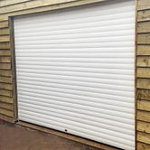 Birkdale Premium White Roller Garage Door on shed