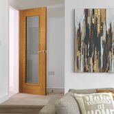 JB Kind Palomino Contemporary Unfinished Oak Veneer Glazed with Clear Glazing Internal Door lifestyle